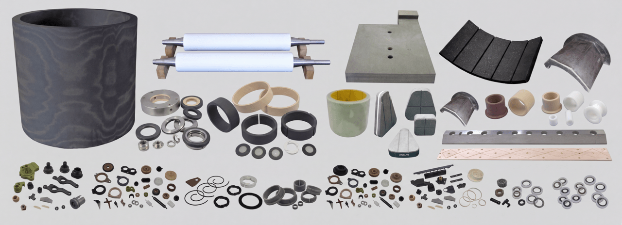 Large collection of industrial machine components—bearings, seals, gaskets, rings, spacers, and rollers on a white background.