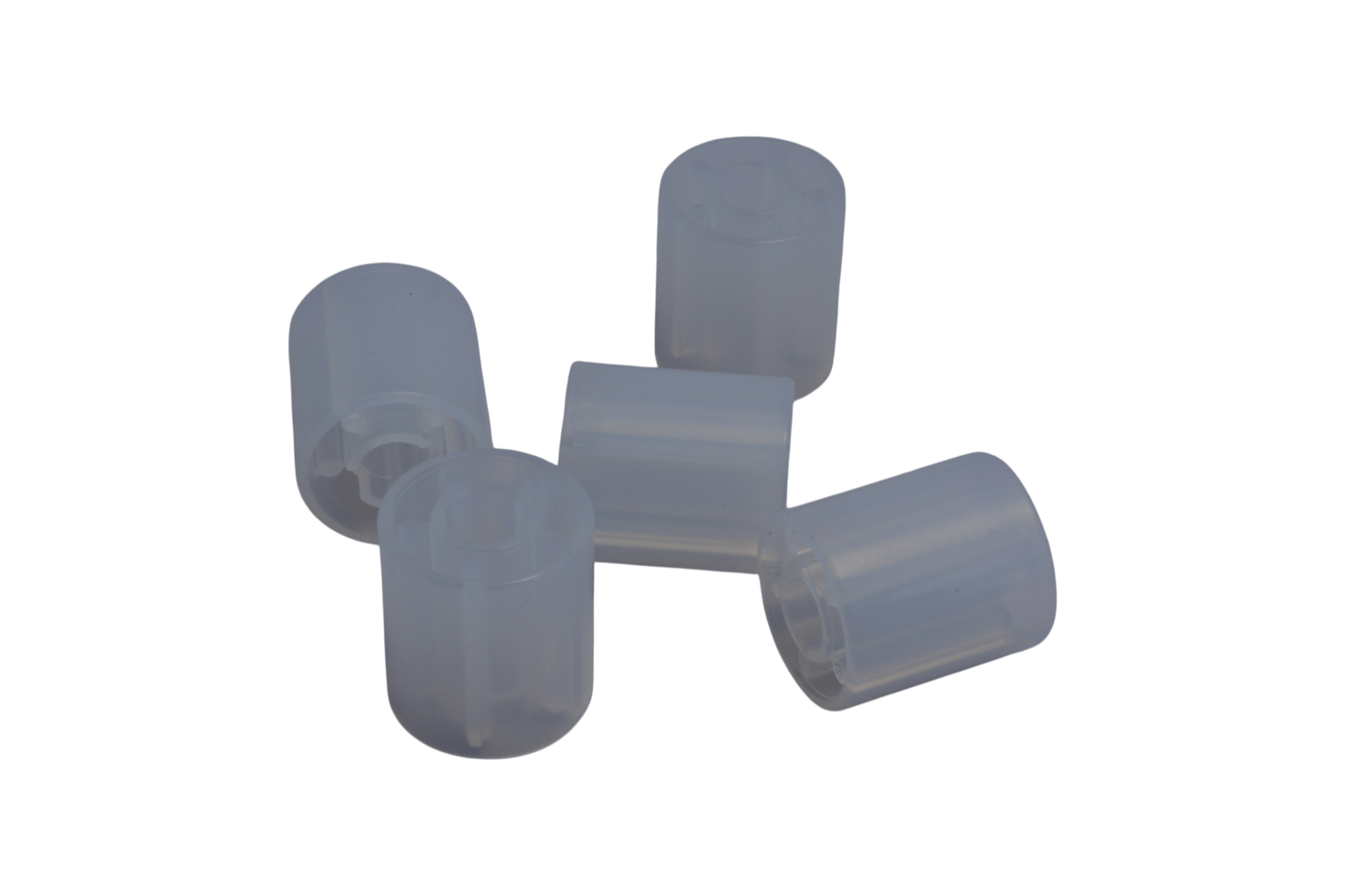 Four translucent plastic end caps connected by a central hub, used to seal tubing ends.